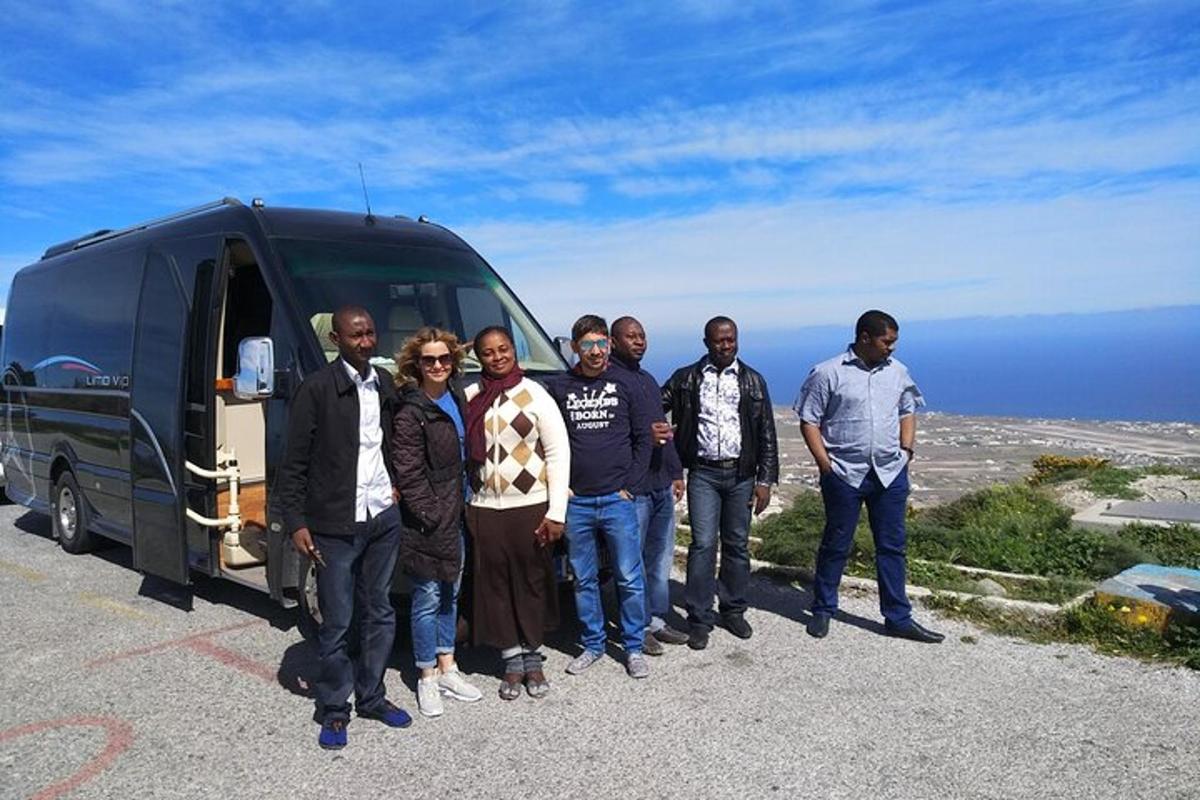 a group of people standing in front of a van