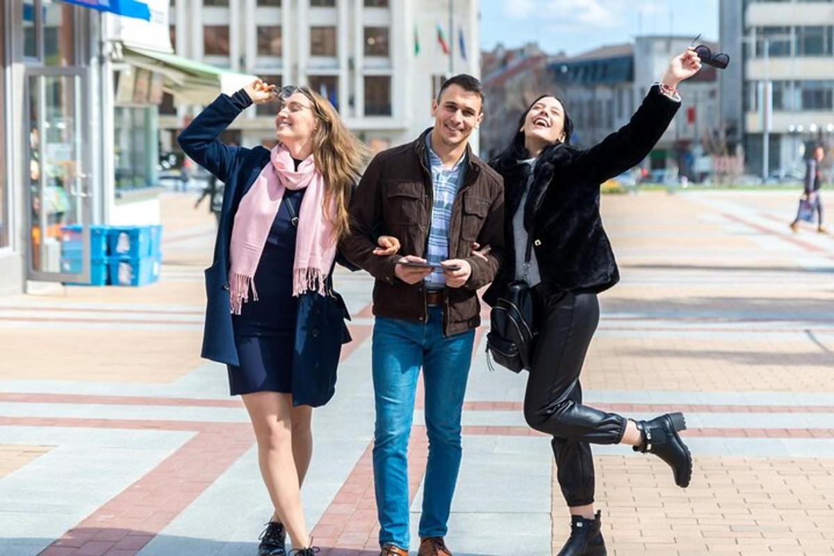 three people walking down a street with their hands in the air