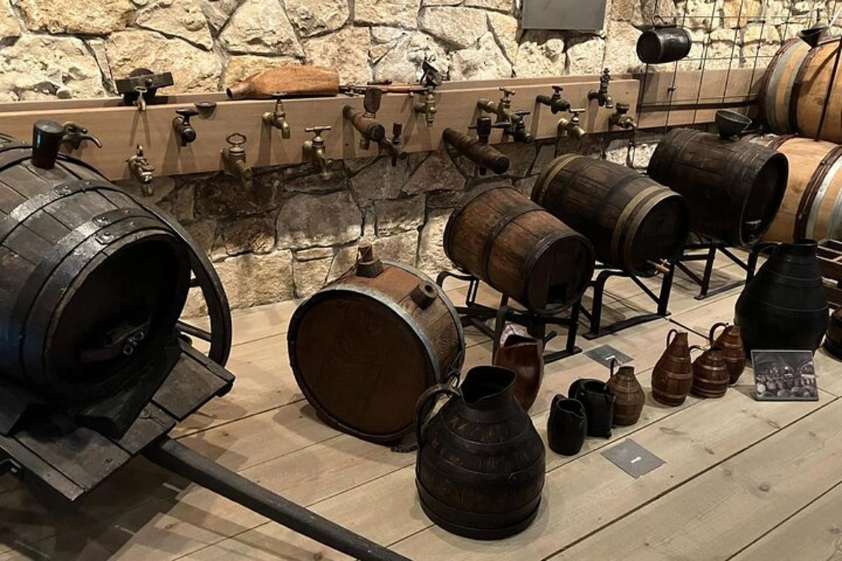 a group of wine barrels and vases on display