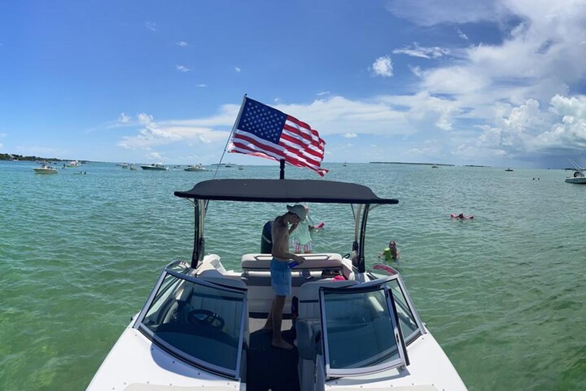 a person on a boat with an american flag on it