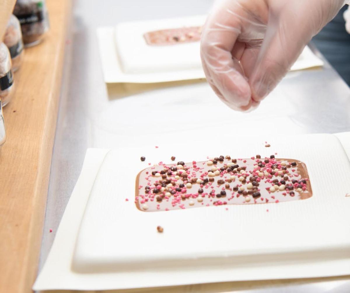 a person is cutting up food on a cutting board