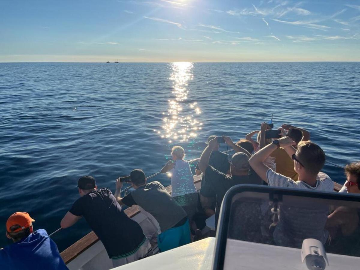 a group of people on a boat in the water