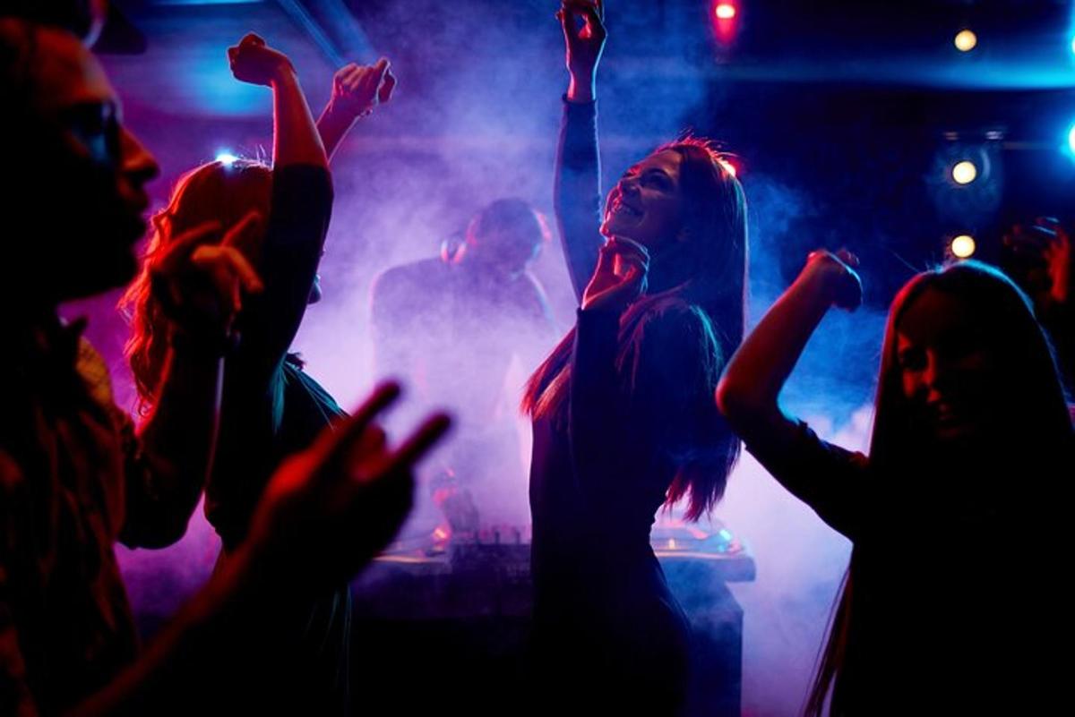 a group of people dancing at a concert