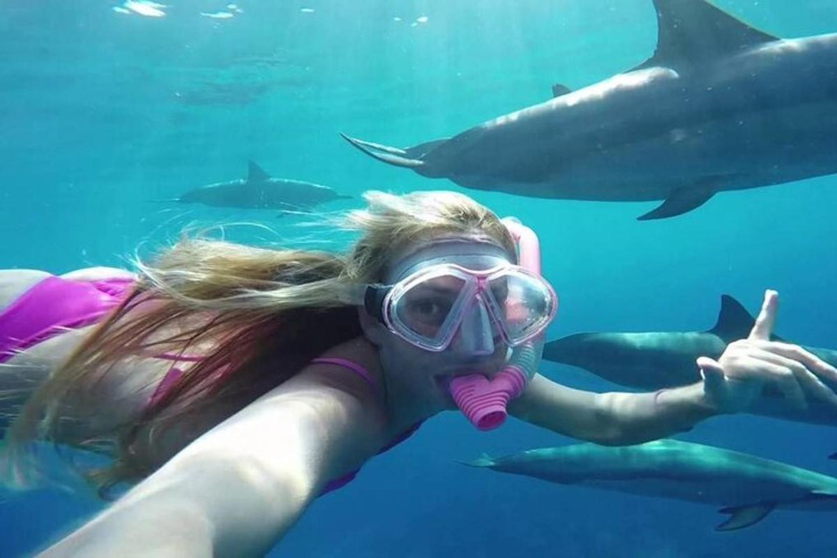 a girl in a gas mask and sharks in the water