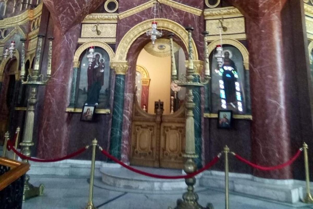 a church with a red ribbon in front of a wooden door