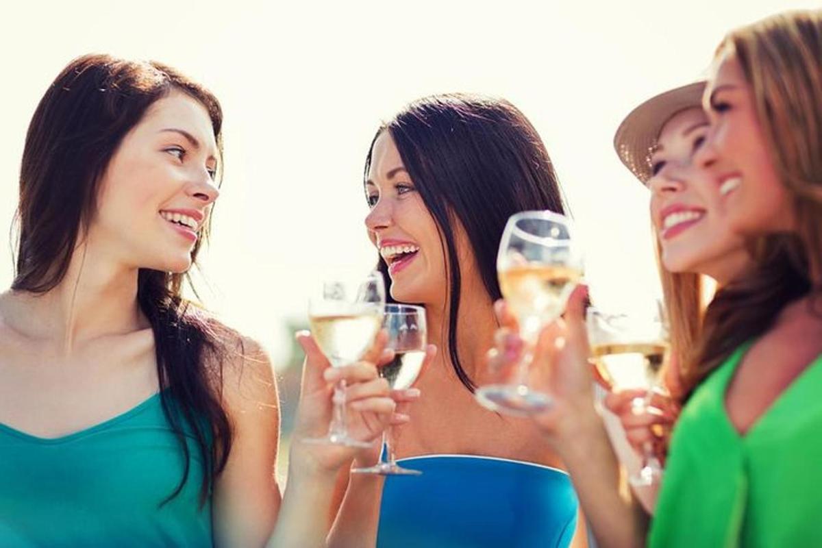 a group of women holding glasses of champagne