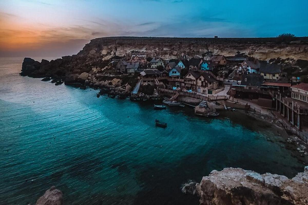 an aerial view of a small town on the ocean