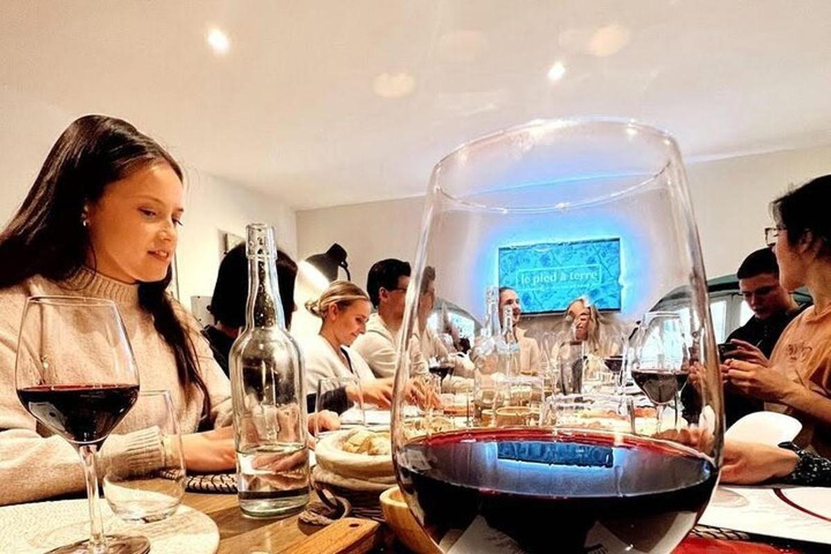 a group of people sitting at a table with wine glasses