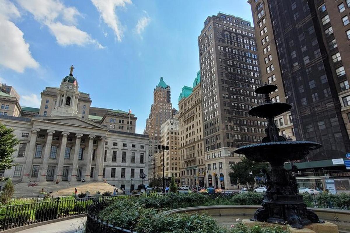 a fountain in the middle of a city with buildings