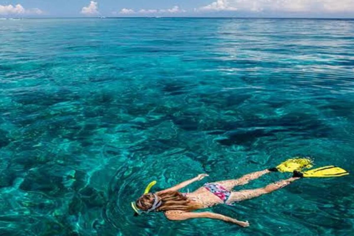 a woman floating in the water in the ocean