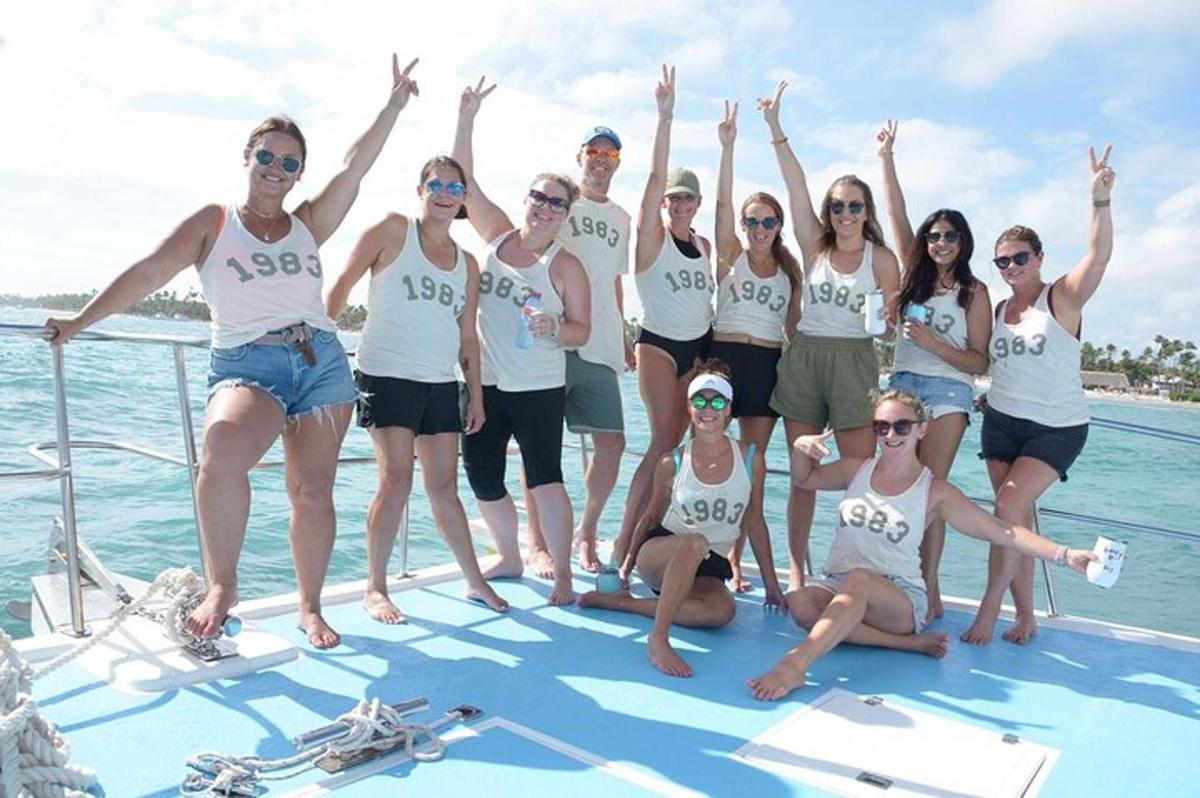 a group of people on a boat in the water