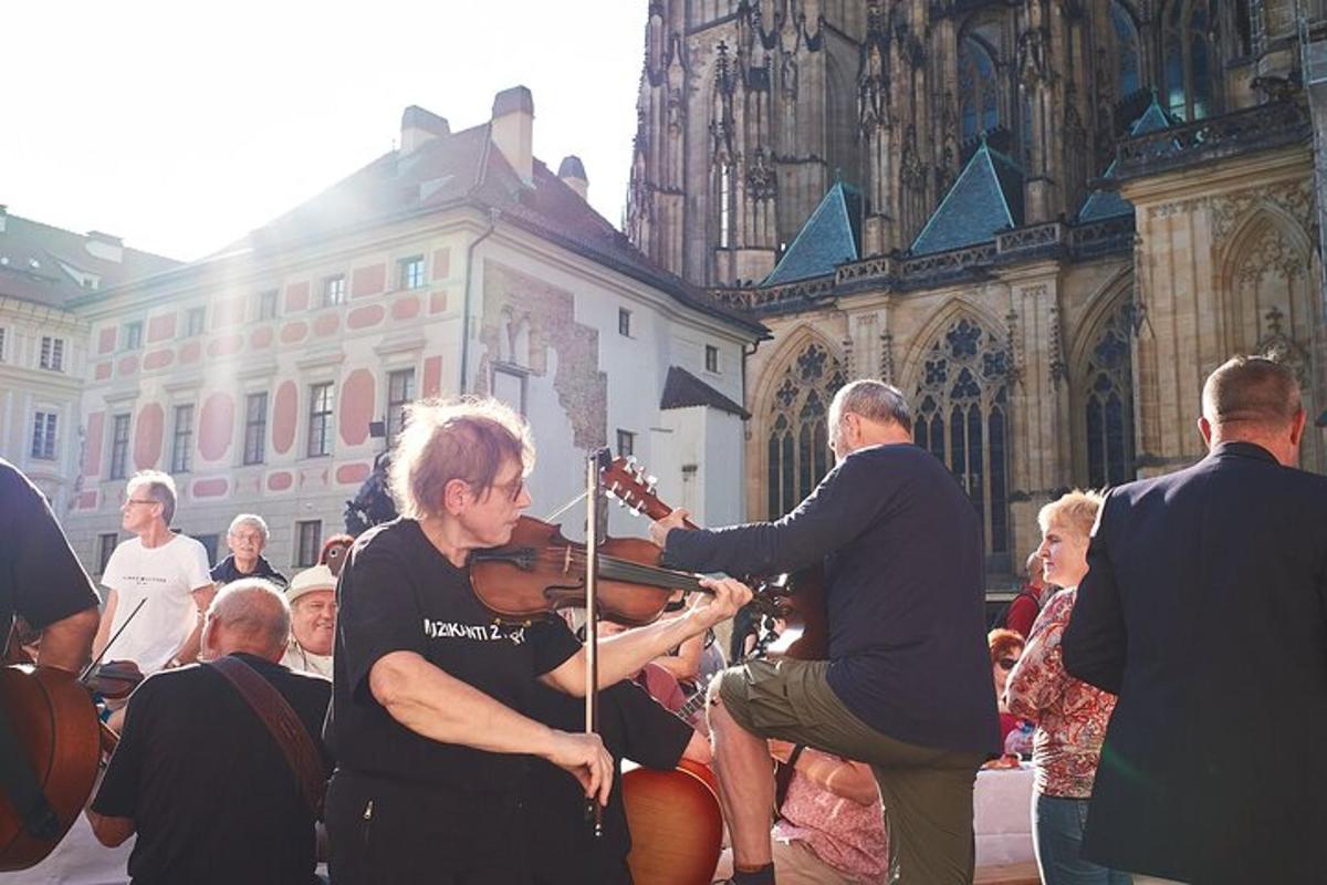 a woman playing a violin in front of a cathedral