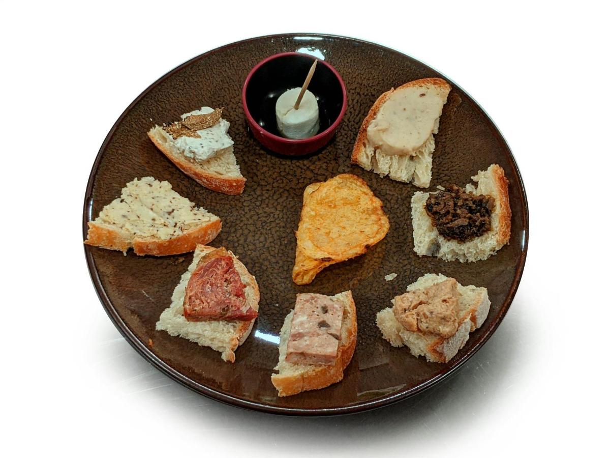 a plate with a bunch of different types of sandwiches