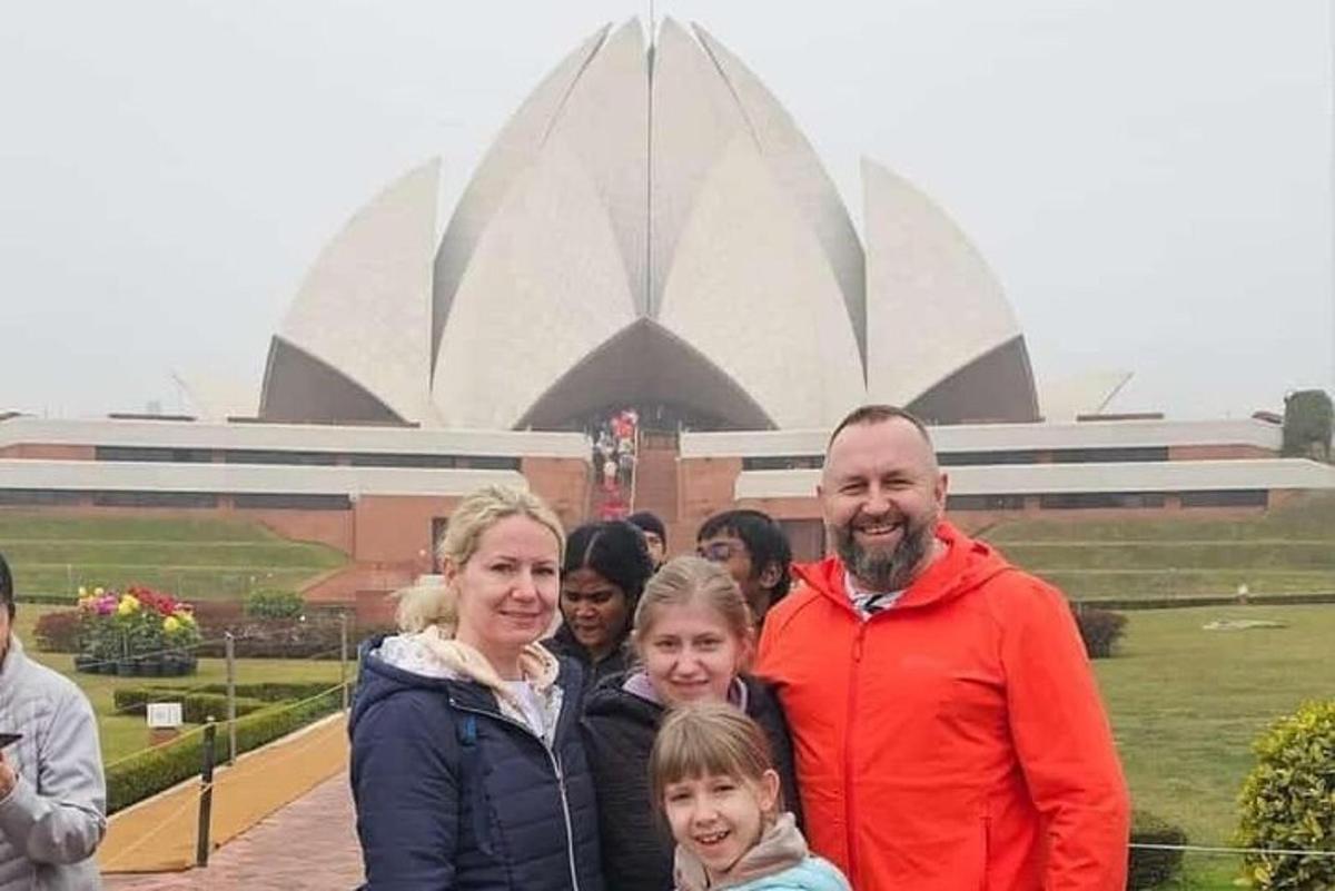 a group of people standing in front of a building