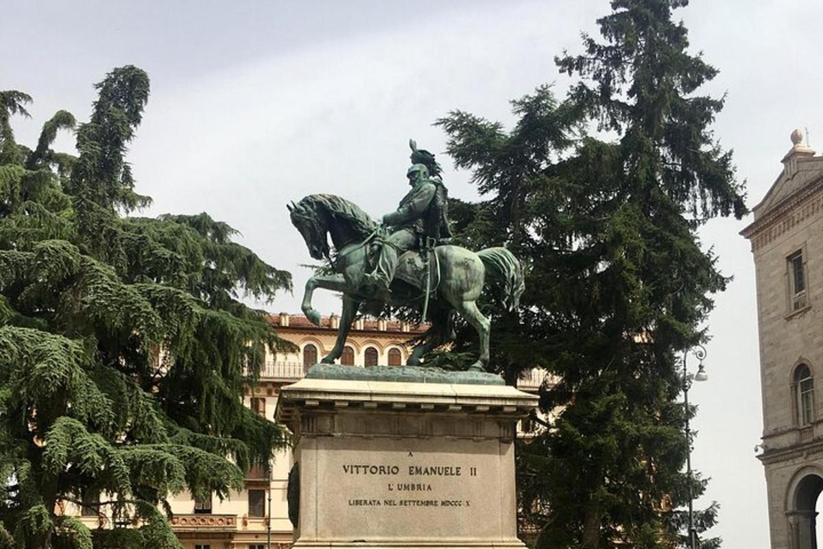 a statue of a man on a horse in front of a building