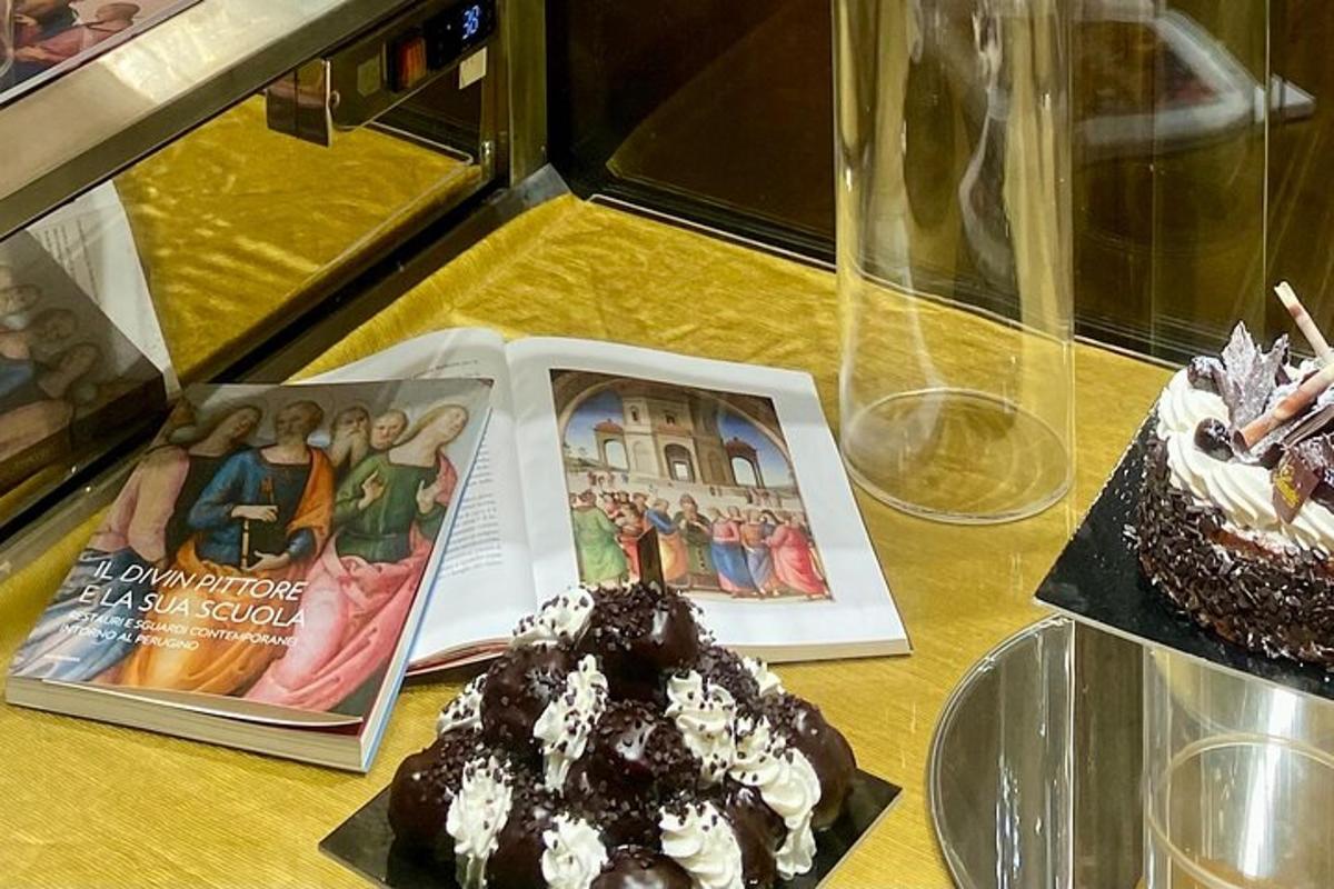 a table with two cakes and a book on it