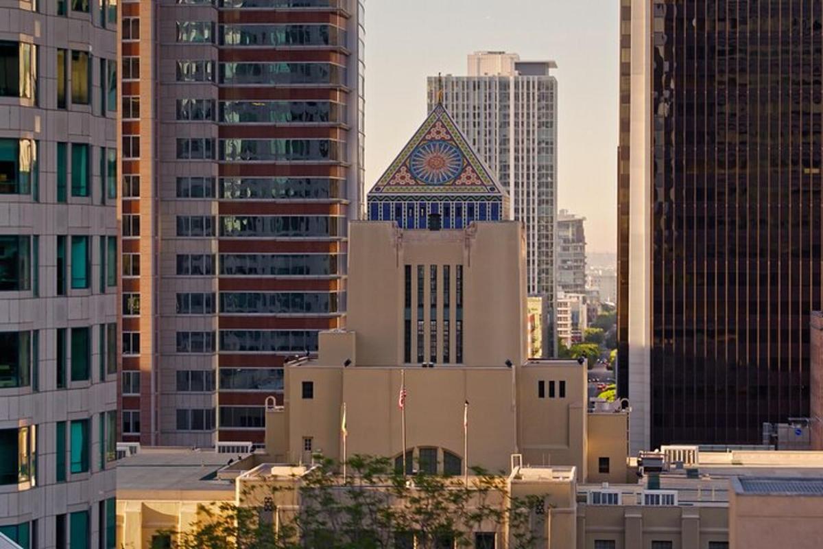 a view of a building in a city with tall buildings
