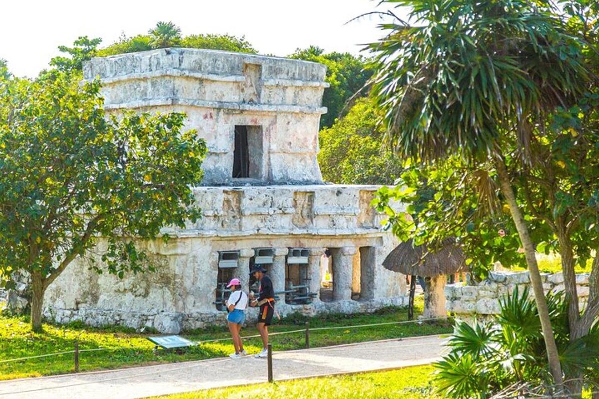 two people standing in front of an old building
