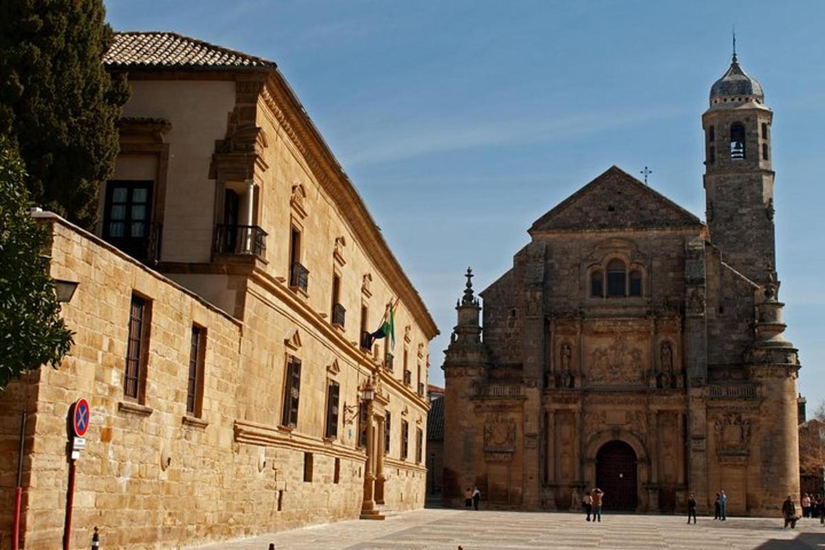 an old building with a clock tower and a church