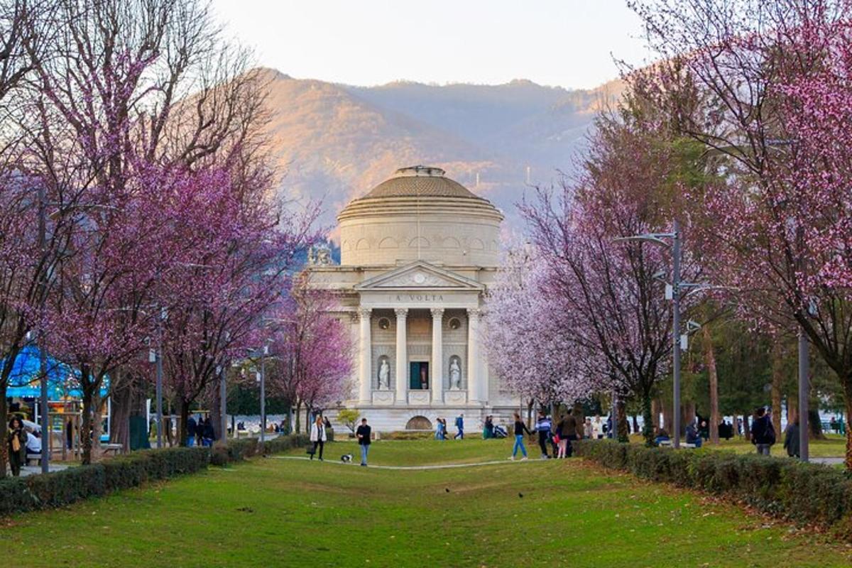 a building with a dome in a park with trees