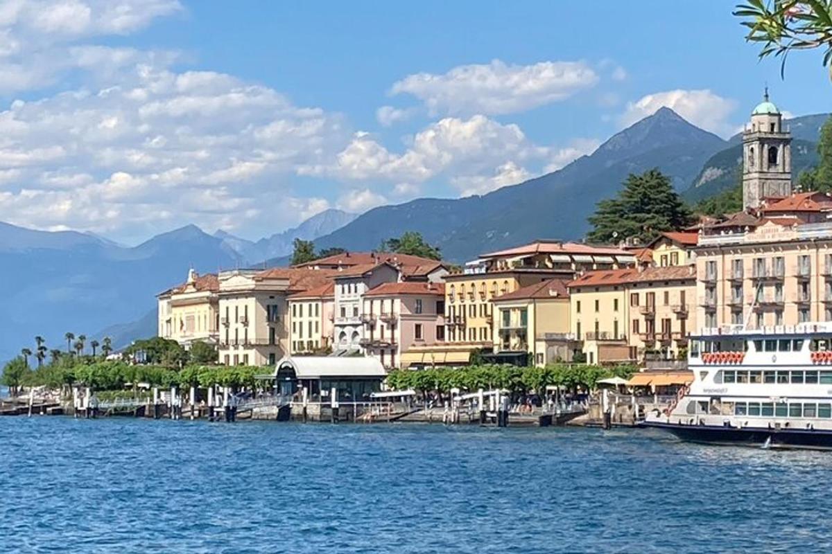 a group of buildings on the water with a boat