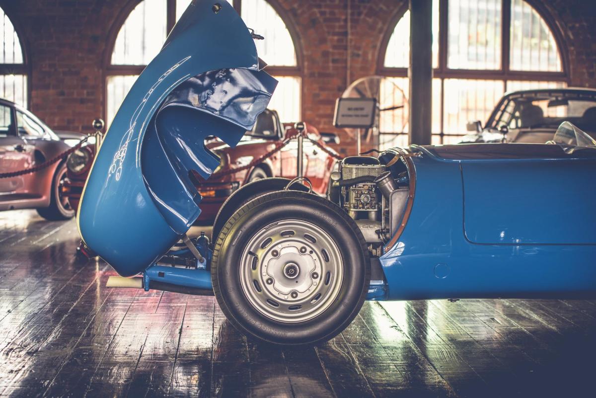 a blue car is parked in a garage