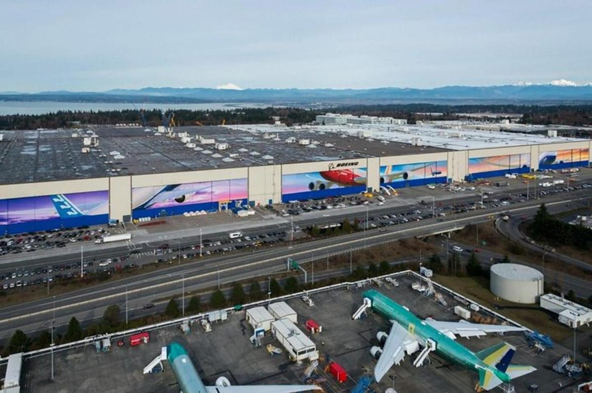 an airport with airplanes parked in a parking lot