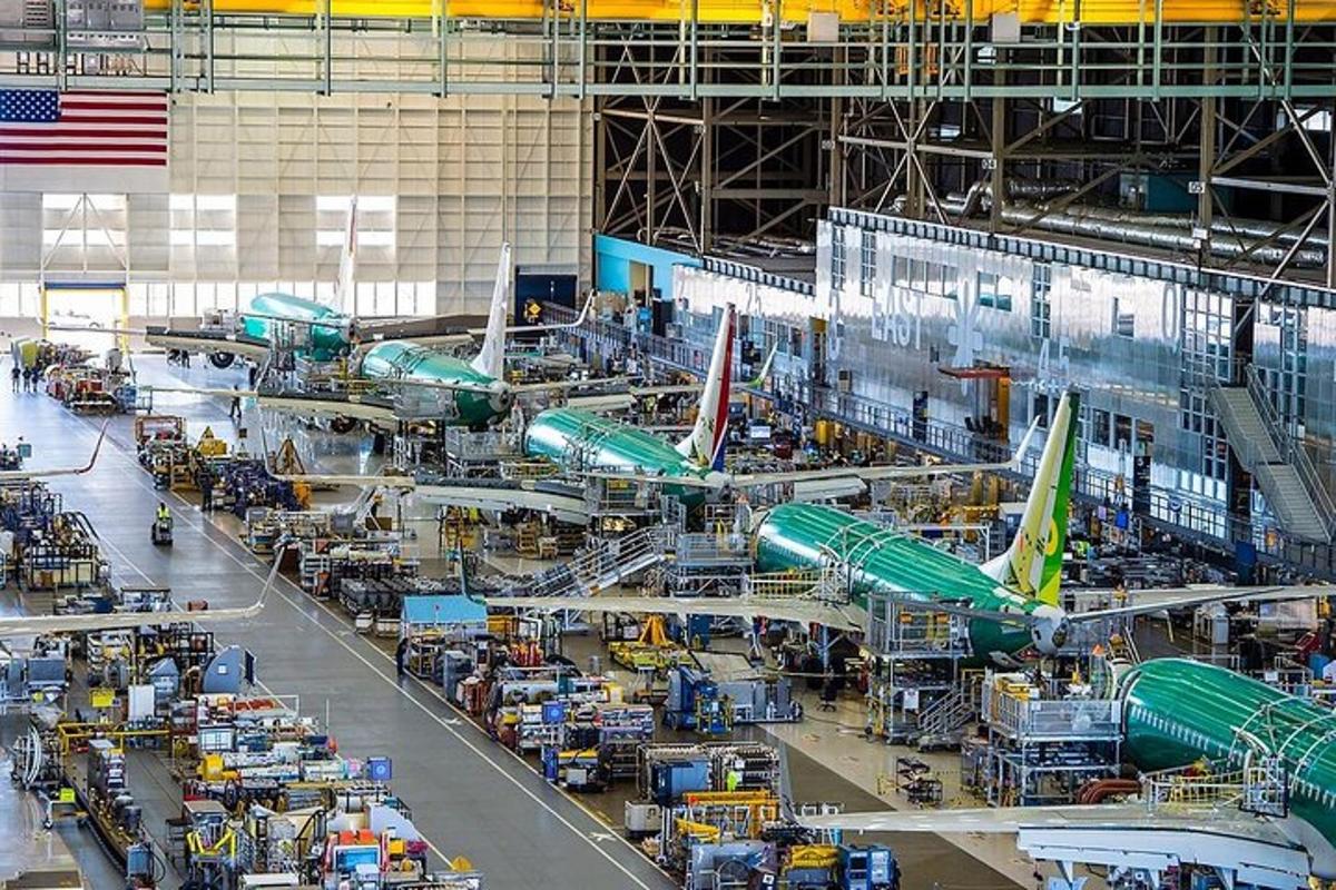 an airplane factory with airplanes being worked on