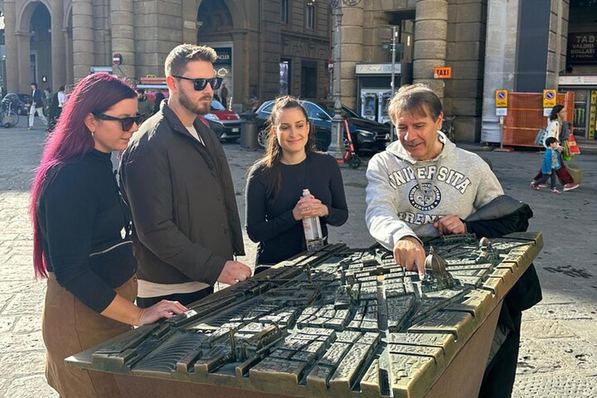 μια ομάδα ανθρώπων που στέκονται γύρω από ένα τραπέζι με ένα κλουβί