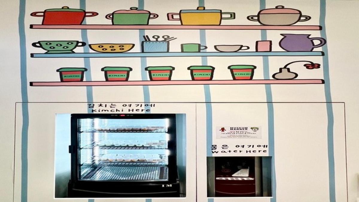 a display of pots and pans on shelves above an oven