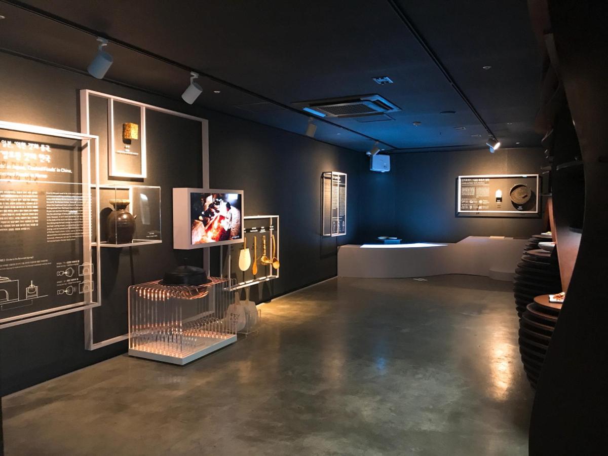 a room with a tv and some pictures on the wall