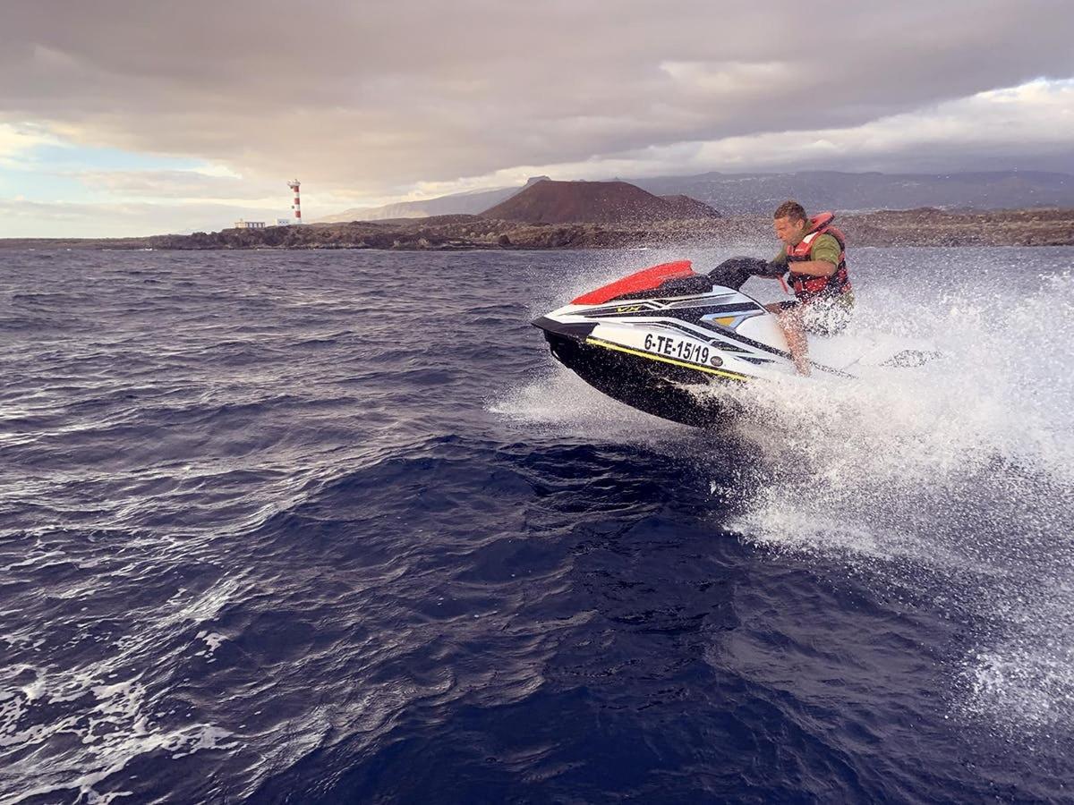 a man riding a speed boat in the water