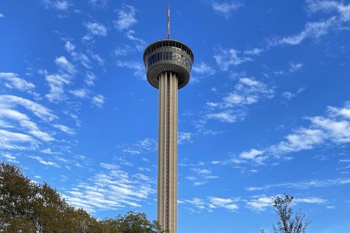 a tall tower with a blue sky in the background
