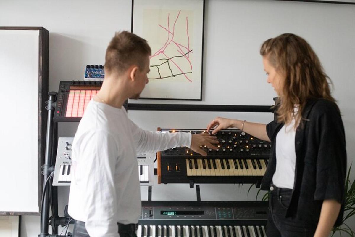a man and a woman playing a keyboard