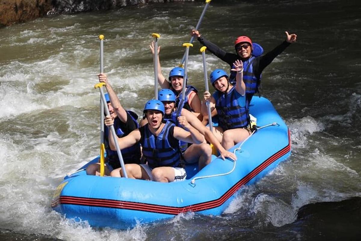a group of people in a raft on a river