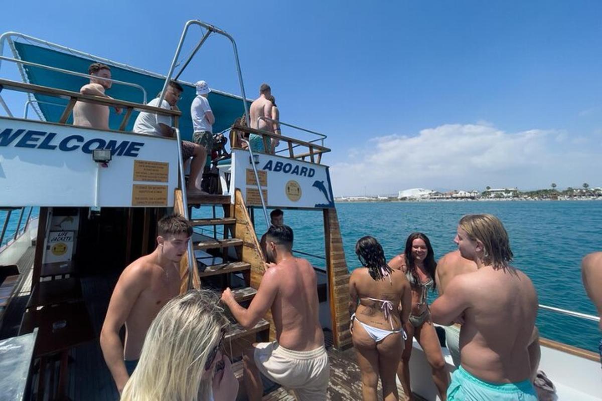 a group of people in bathing suits on a boat