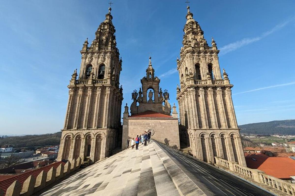 a group of people standing on the roof of a cathedral