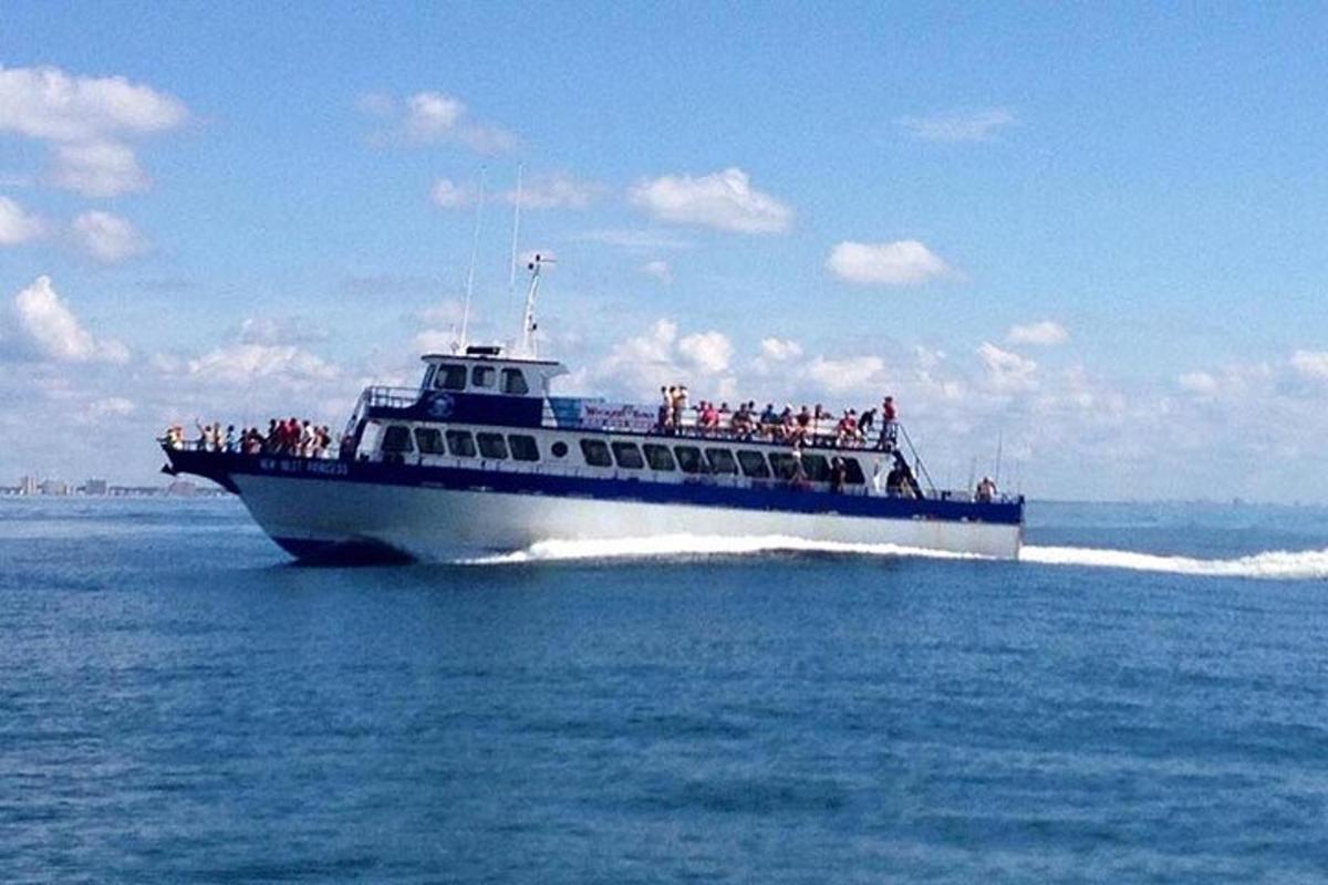 a group of people on a boat in the water