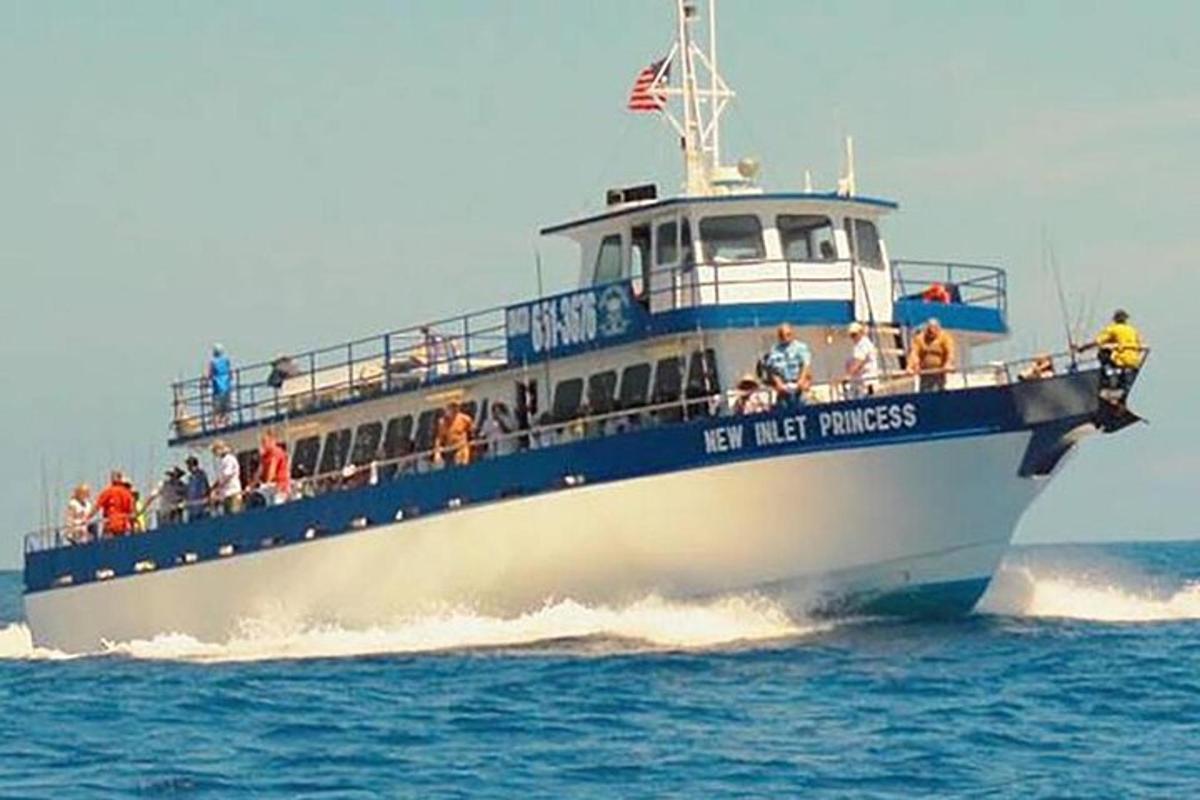 a boat with people on it in the water