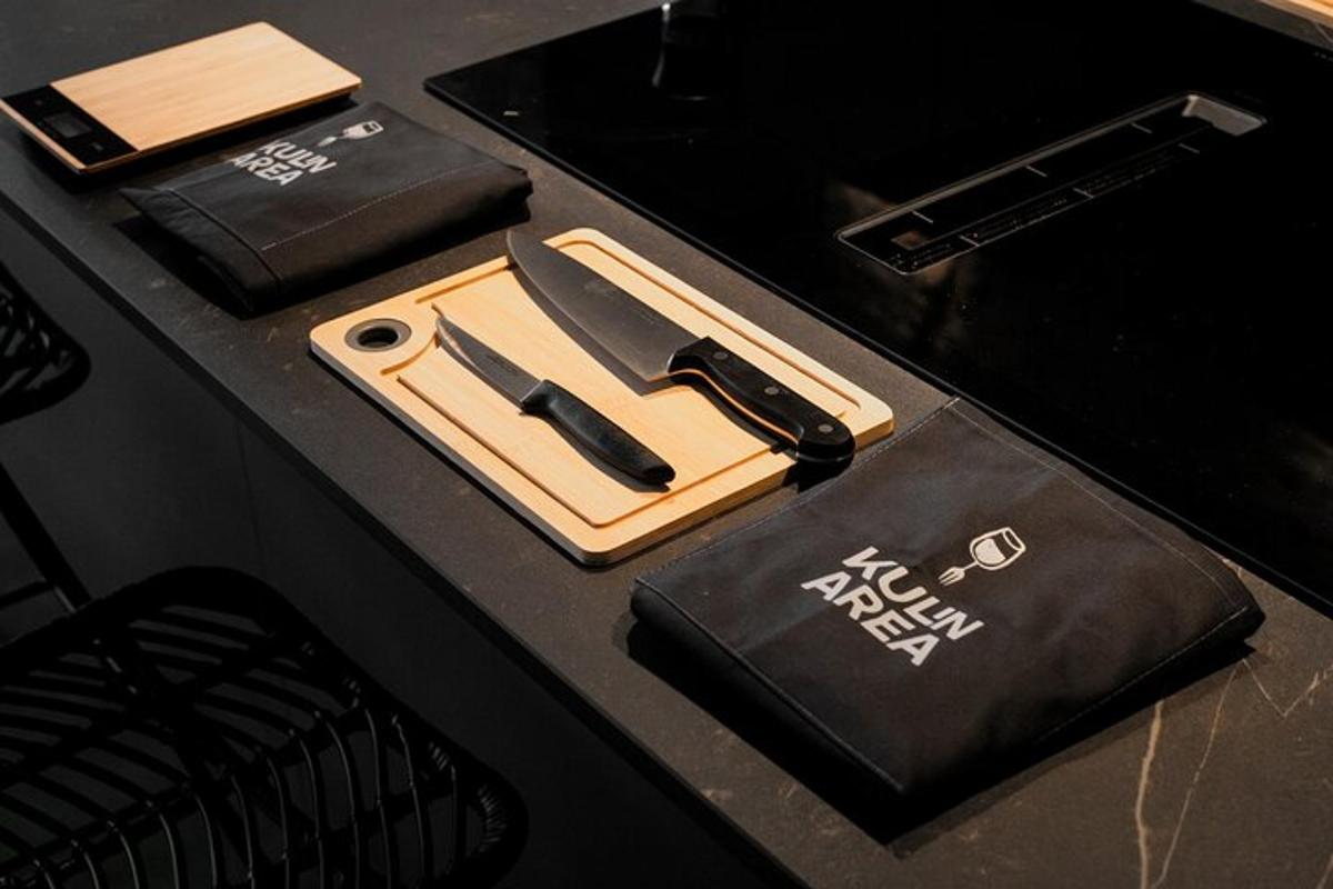 a black table with a knife and a bag on it