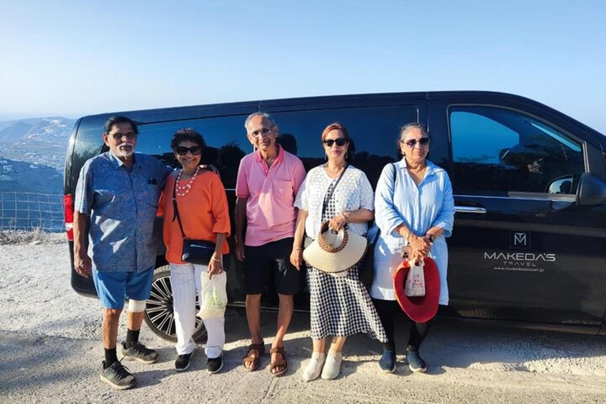 a group of people standing in front of a van