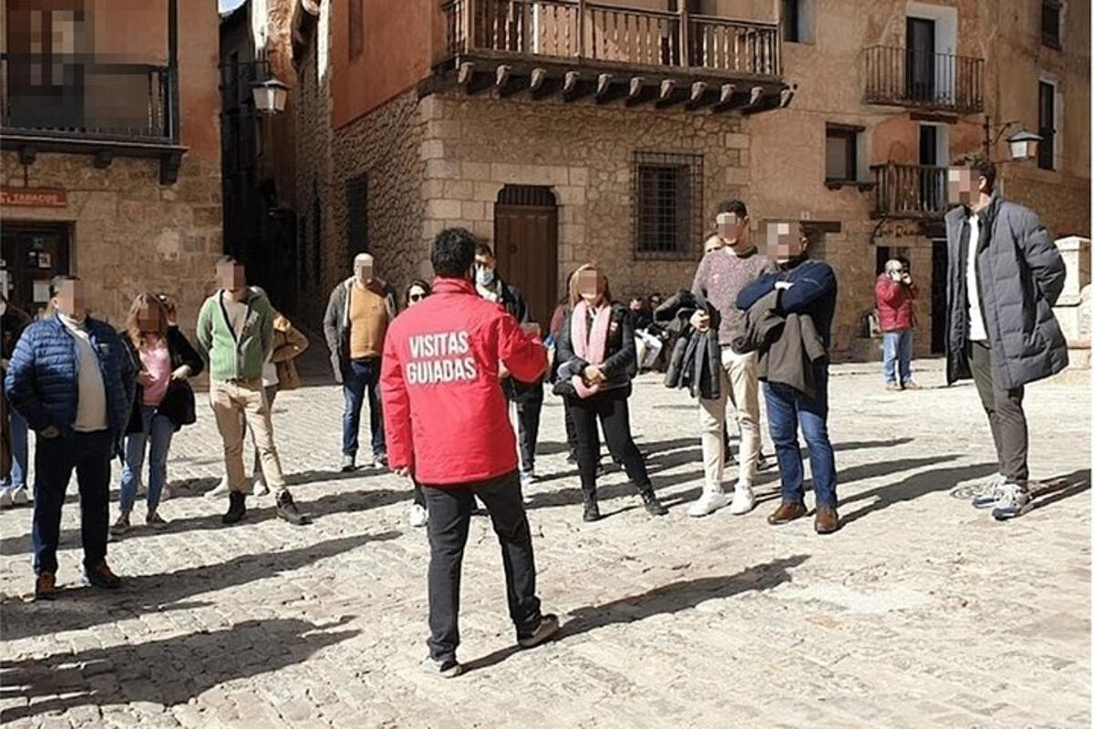 a group of people walking down a street