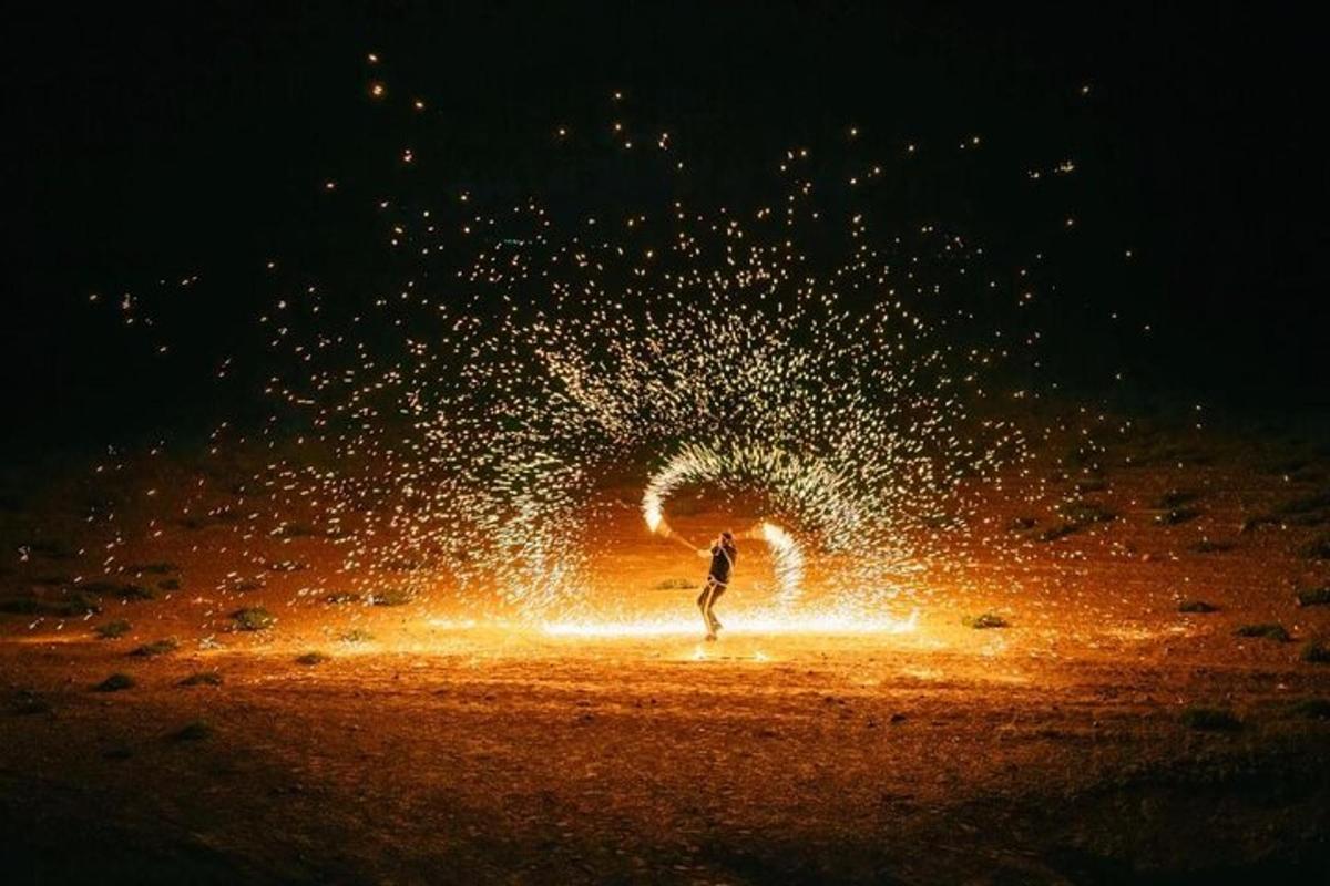 a person standing in front of a water fountain