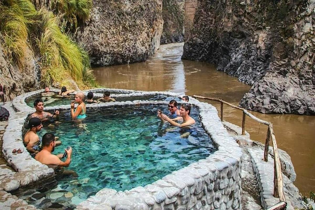 a group of people in a swimming pool in a river
