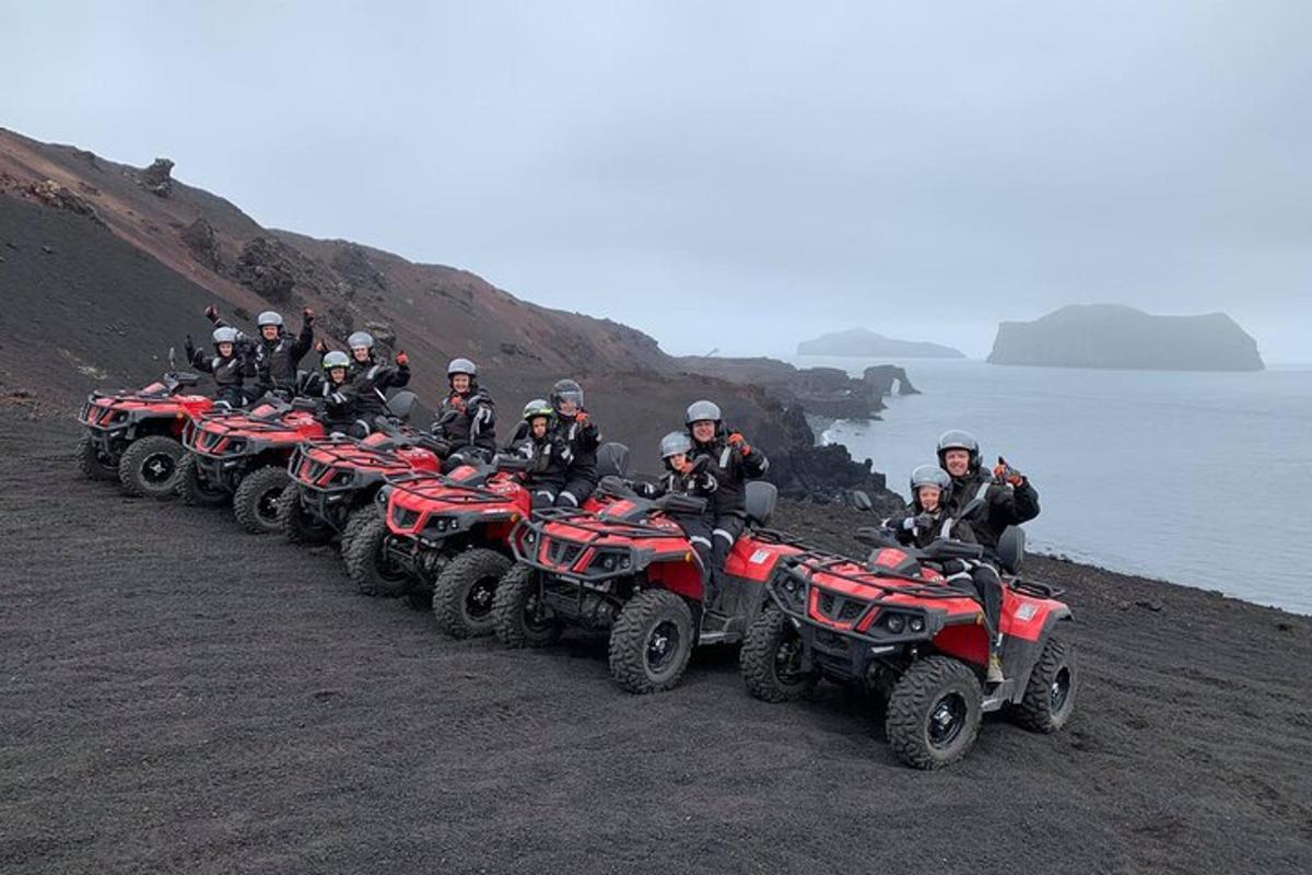 a group of people riding atvs on a beach