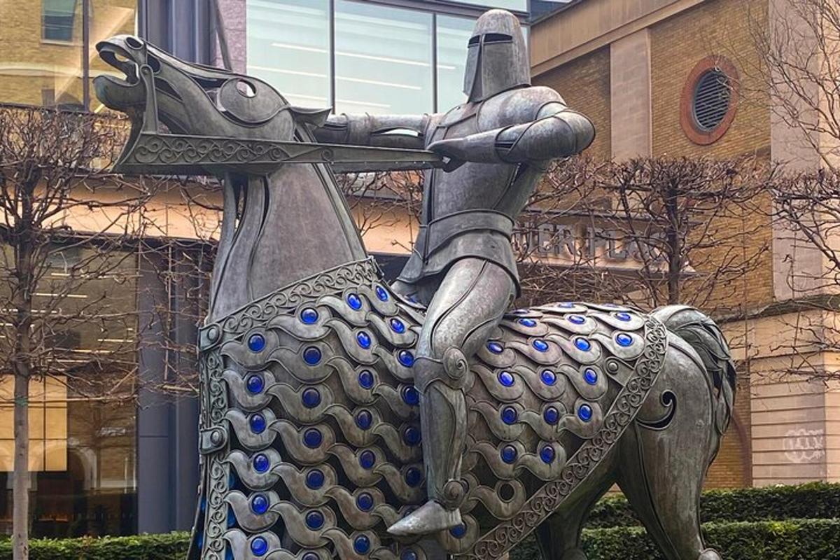 a statue of a person holding a sword