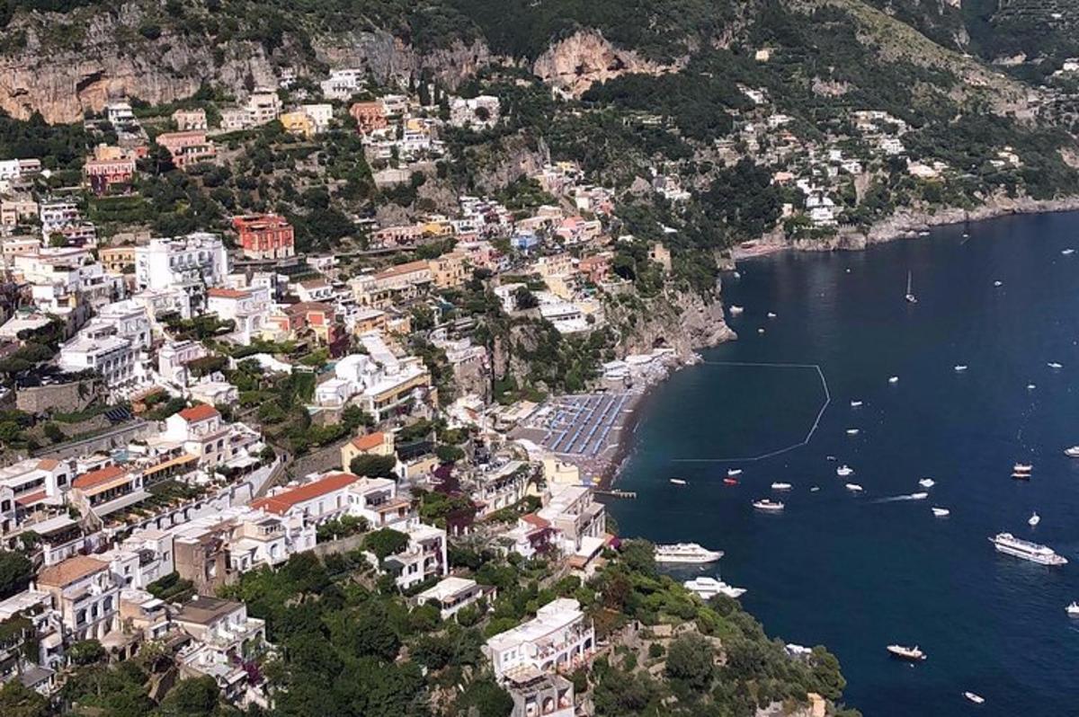an aerial view of a town on a hill near the water