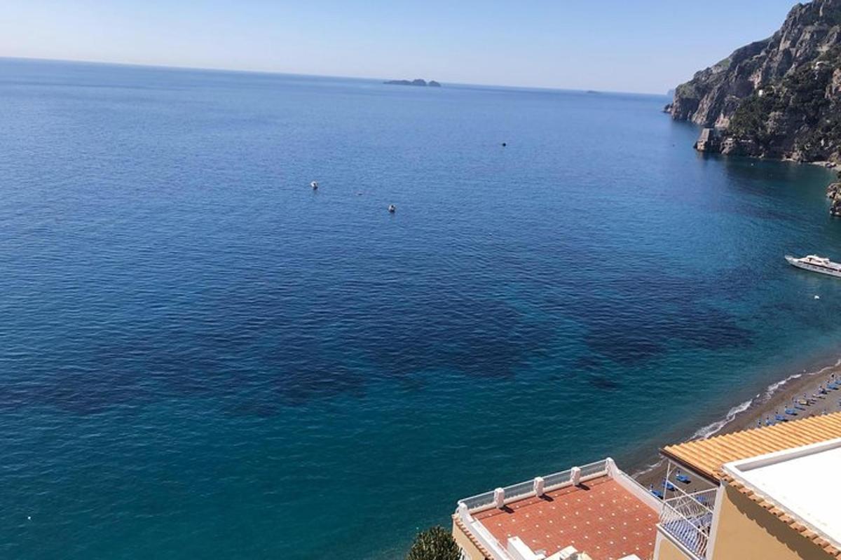 an aerial view of a body of water with a beach