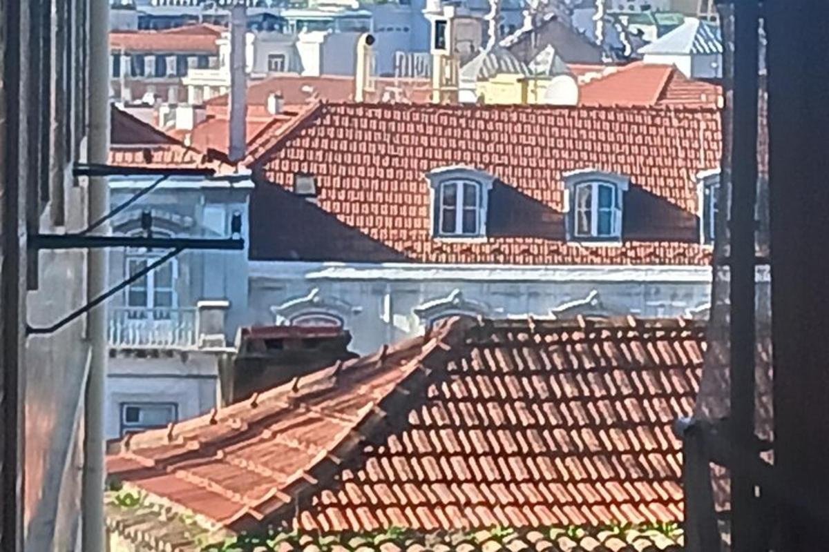 a view of roofs of a city with buildings