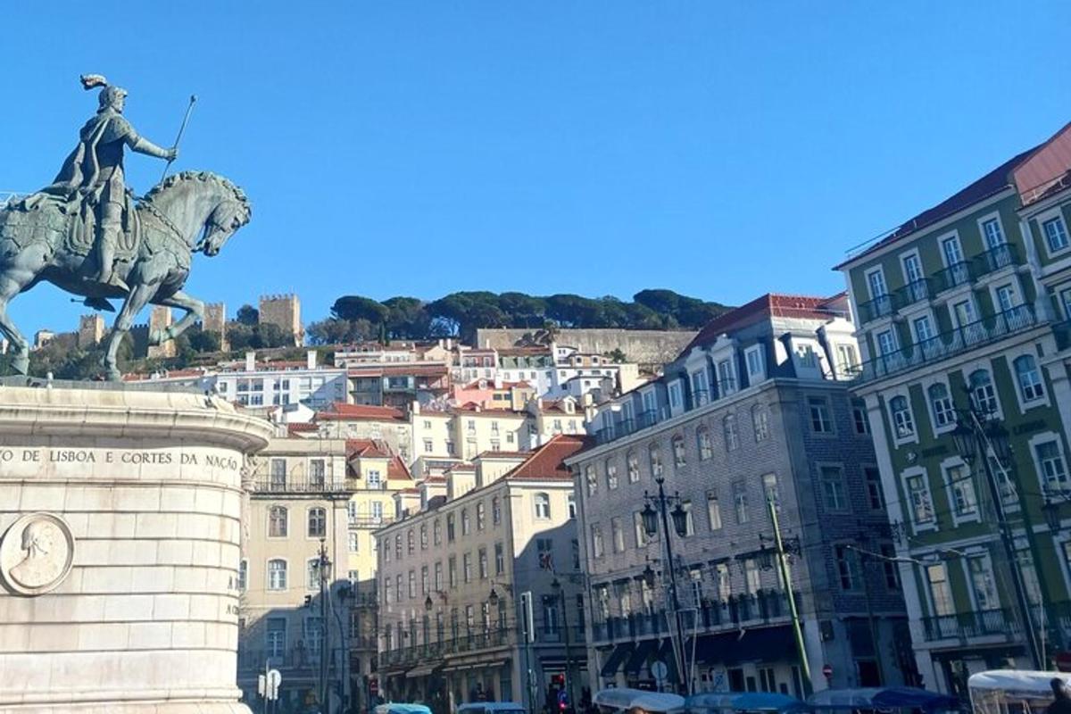 a statue of a man on a horse in a city
